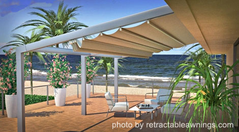 Covered patio overlooking the sea - photo by RetractableAwnings.com (Siracusa model)