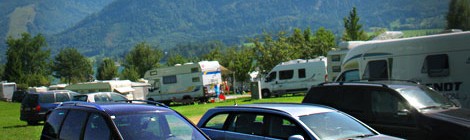 cars and RVs parked in camping site