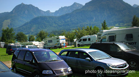 cars and RVs parked in camping site